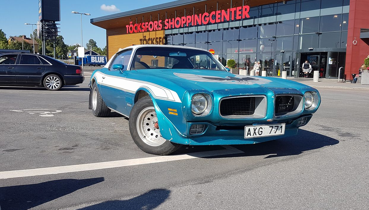 Blue Pontiac Firebird.