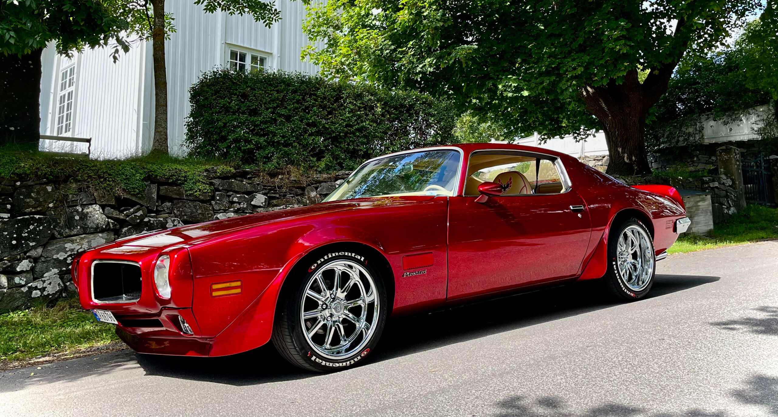 candy red Pontiac Firebird restomod.